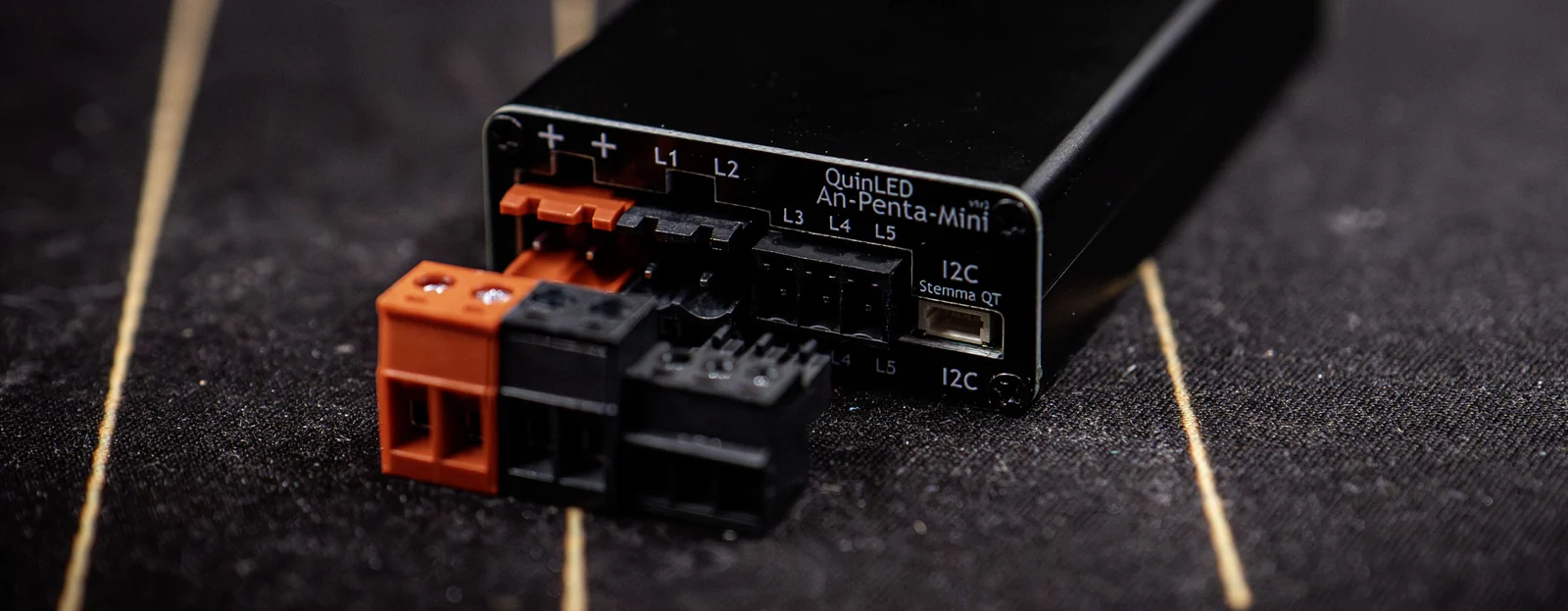 QuinLED An-Penta-Mini, black anodised aluminium case with pluggable terminals and Wi-Fi antenna